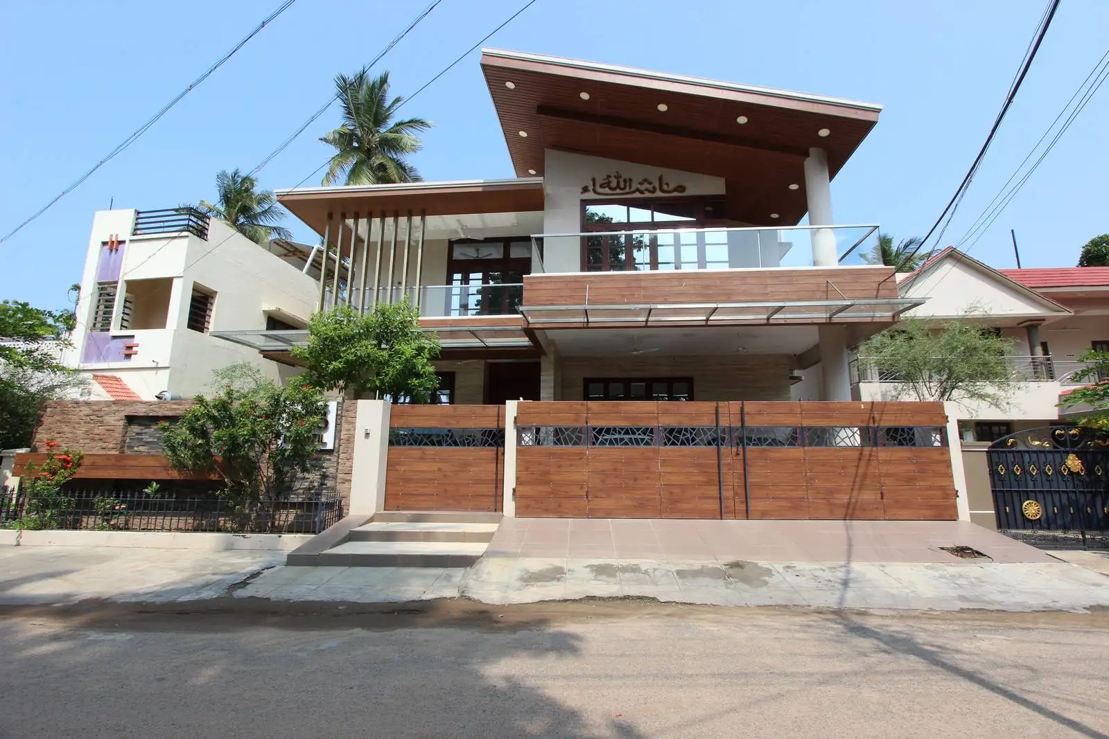 This residence showcases geometric forms and a textured facade, blending minimalism with visual depth and contrast.
