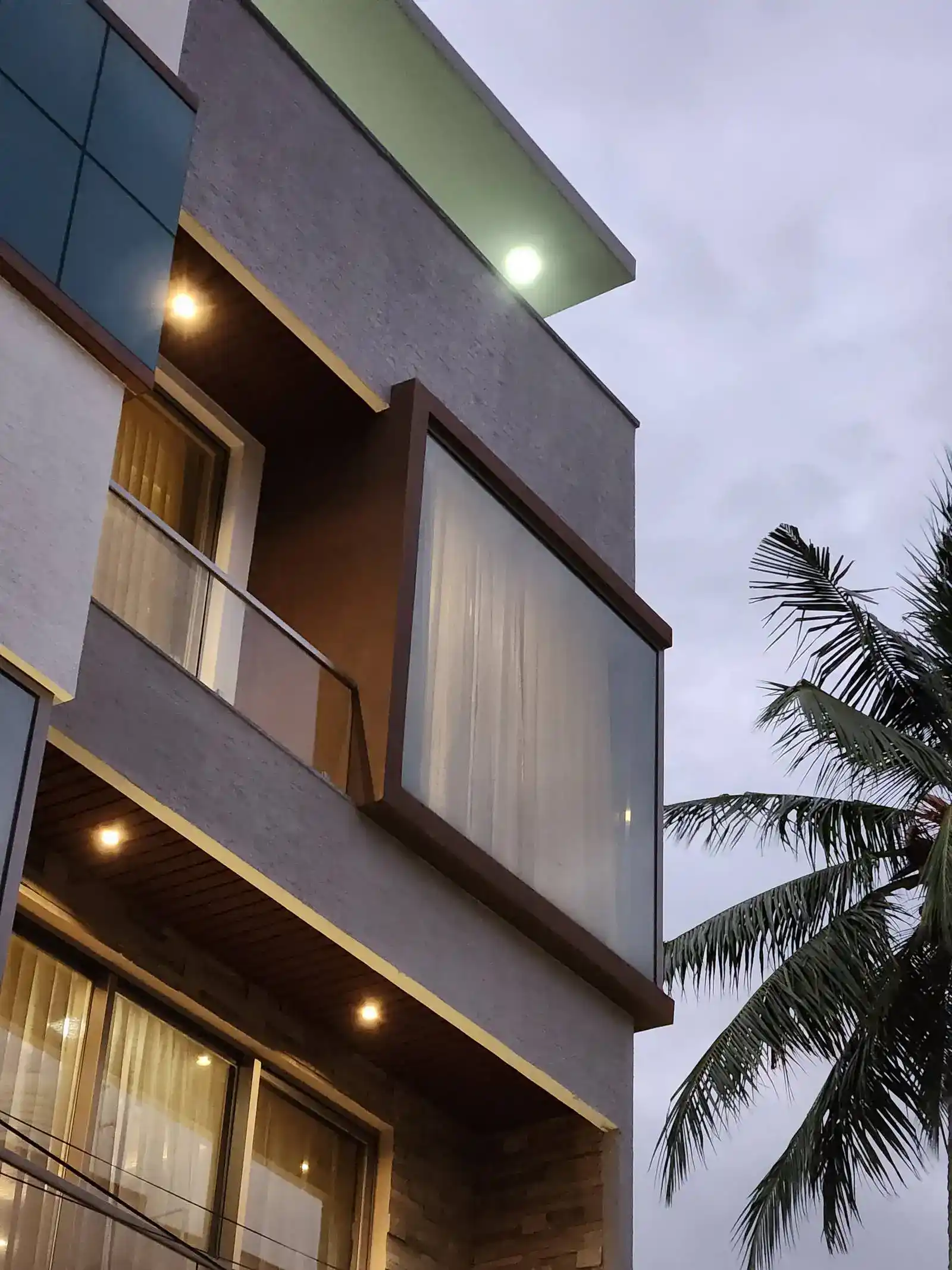 Balconies and large windows offer outdoor space and views, while also contributing to the building’s dynamic facade.