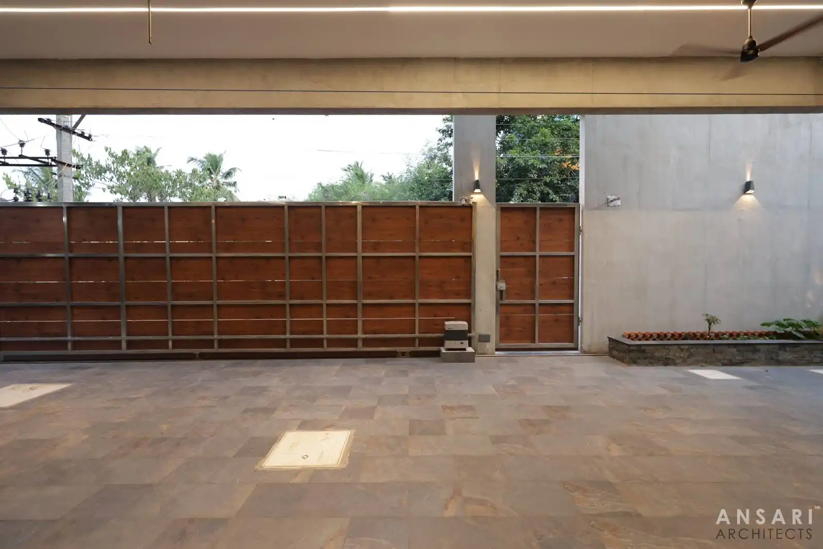 Durable tiled parking and entry blend function with style, enhanced by integrated lighting for safety and aesthetics.