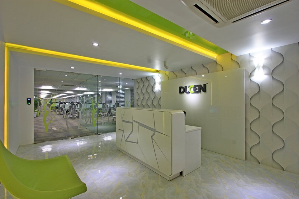 A sleek reception area with brand-focused elements, textured walls, and dynamic lighting that enhances first impressions.