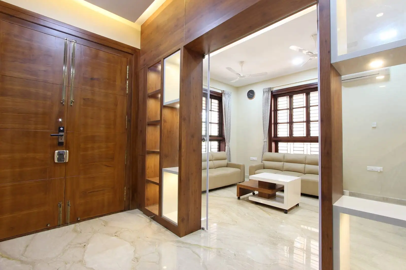 Flexible open-plan space connecting foyer and living area, serving as a welcoming entry and casual lounge.