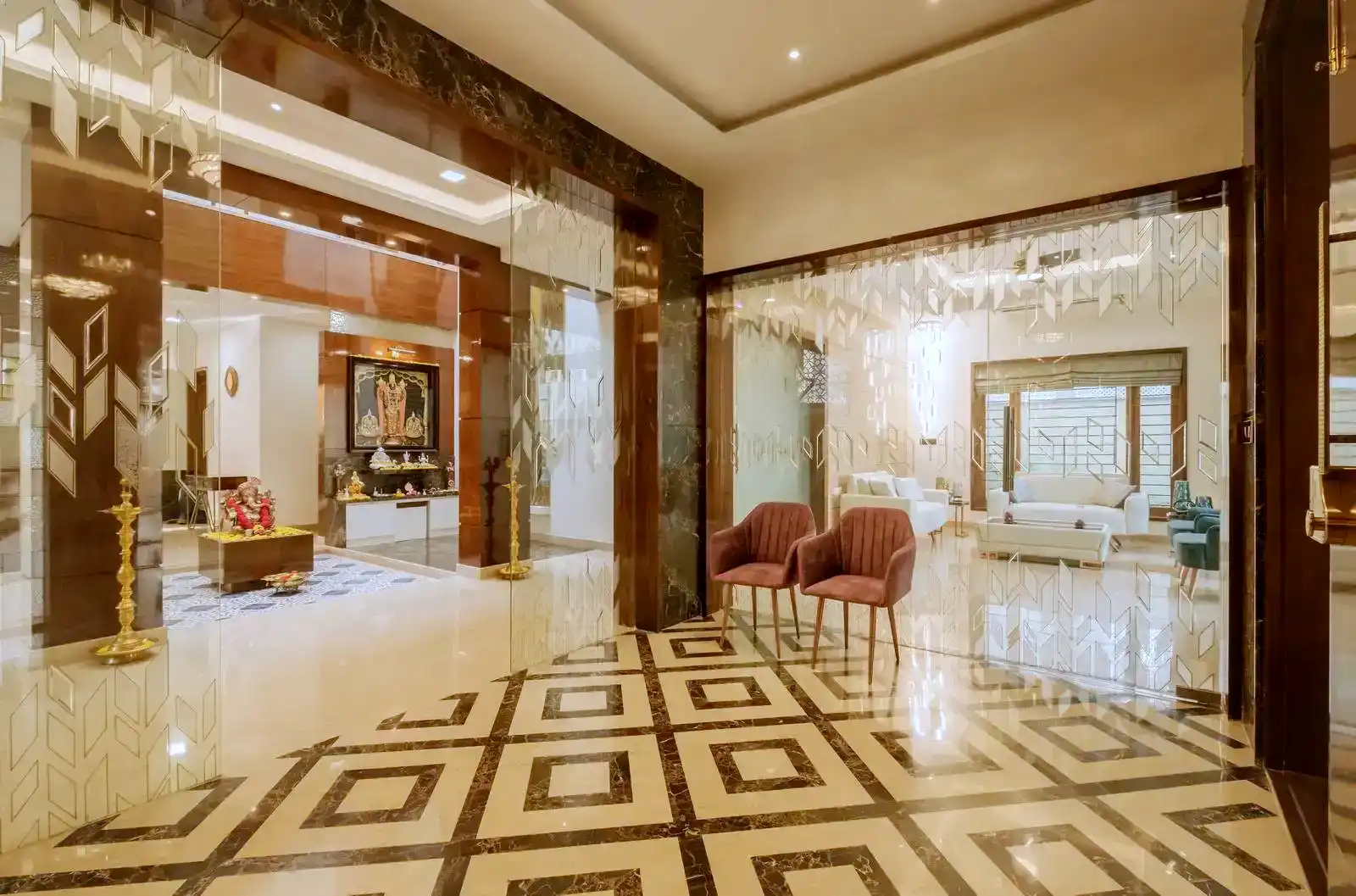 Spacious lobby with etched glass partitions, seamlessly connecting the living room and pooja area while maintaining visual openness and subtle zoning.