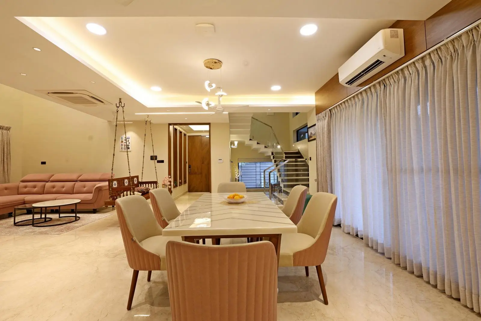 Minimalist cabinetry, glass railings, and layered lighting ensure a modern, elegant, and functional interior.