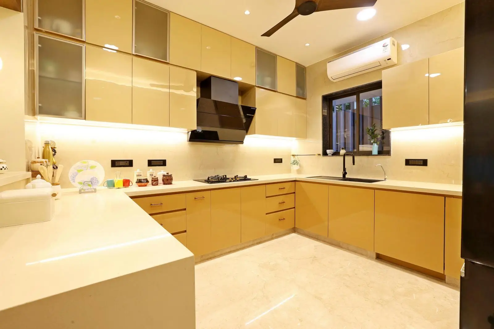 The U-shaped kitchen optimizes workflow with an ergonomic work triangle and ample counter space. 