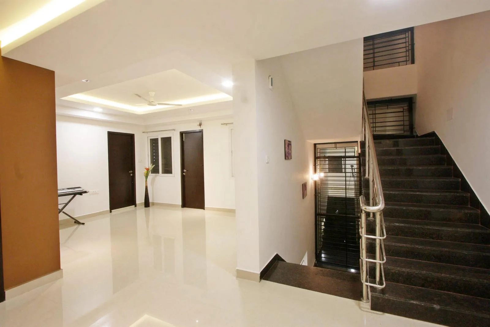 A small family lounge on the second floor functions as a music room, offering a relaxed and intimate space for leisure and creative pursuits.