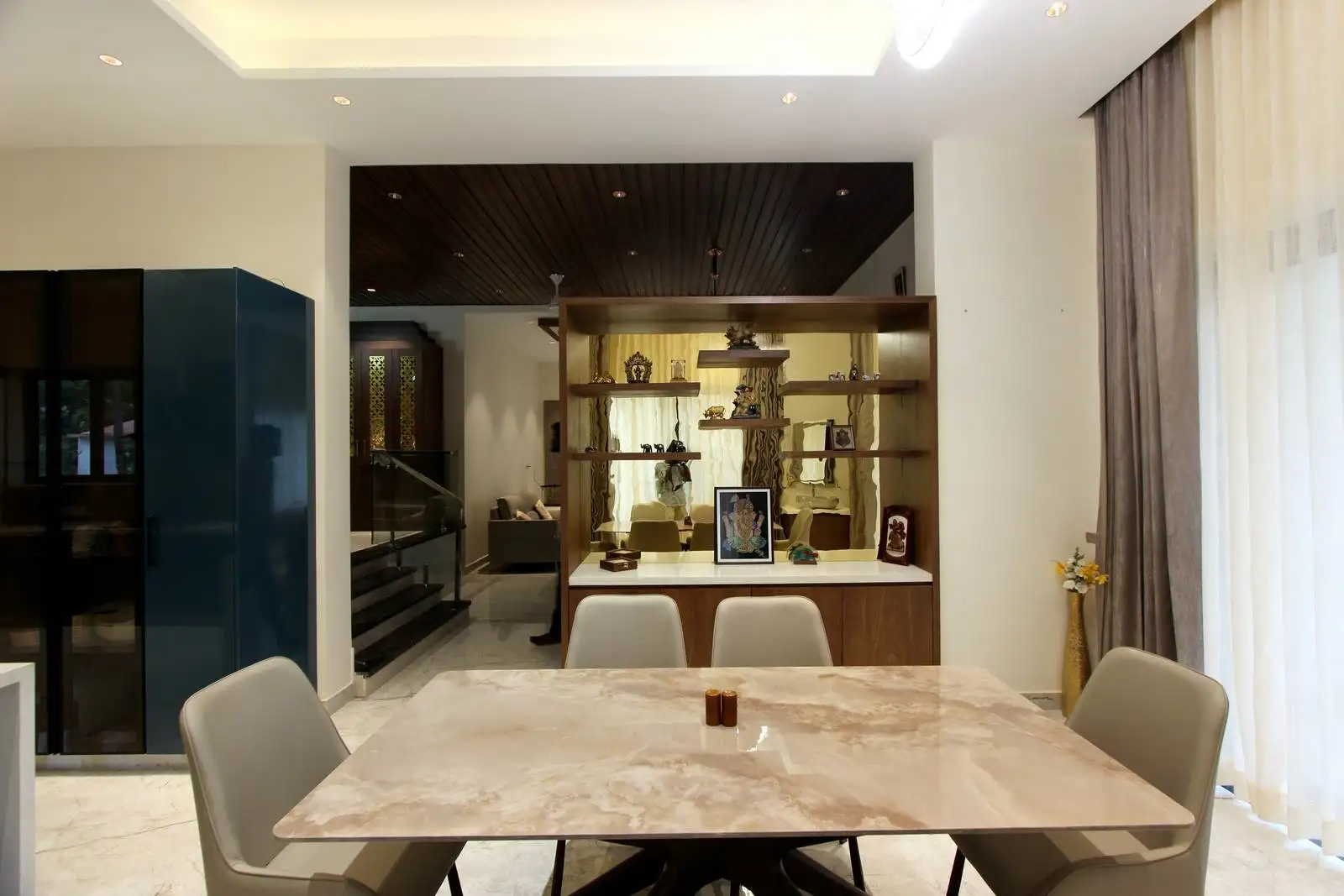 Open layout ensures a fluid connection between dining, kitchen, and living spaces, enhancing both functionality and visual openness.