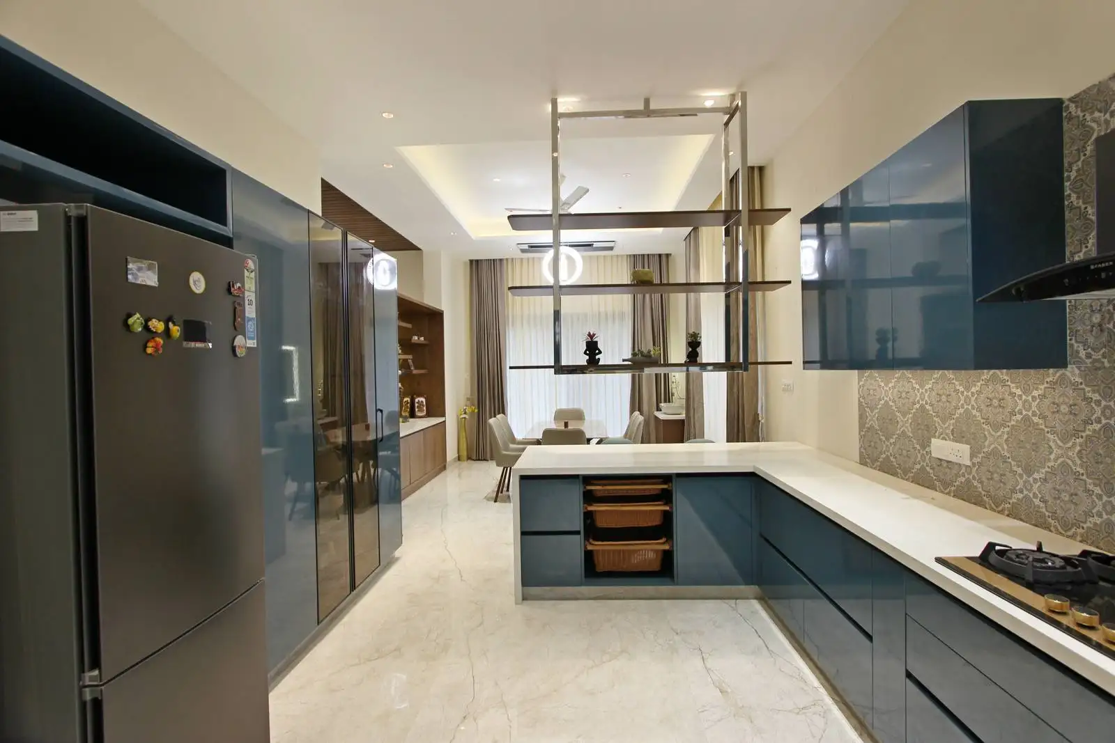 L-shaped kitchen with ample counter space and lower cabinetry for storage. The design maximizes efficiency and workflow.