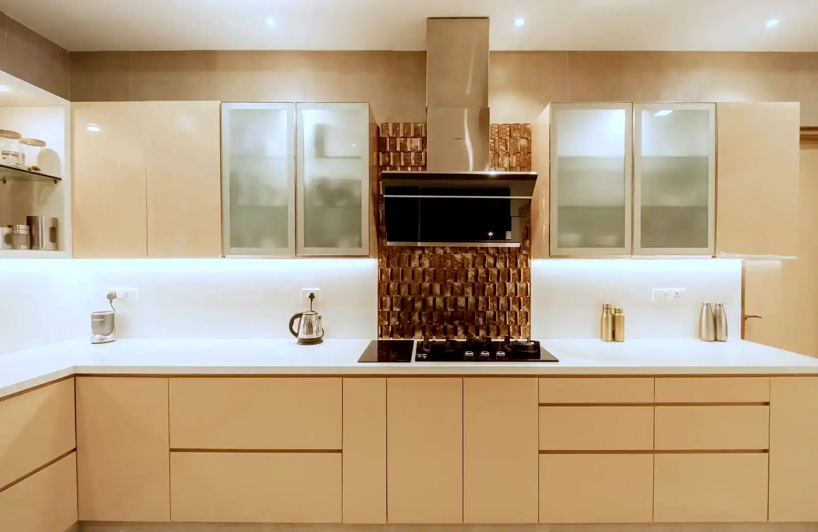 The L-shaped kitchen layout maximizes corner space and ensures efficient workflow with clearly defined cooking, prep, and cleaning zones.