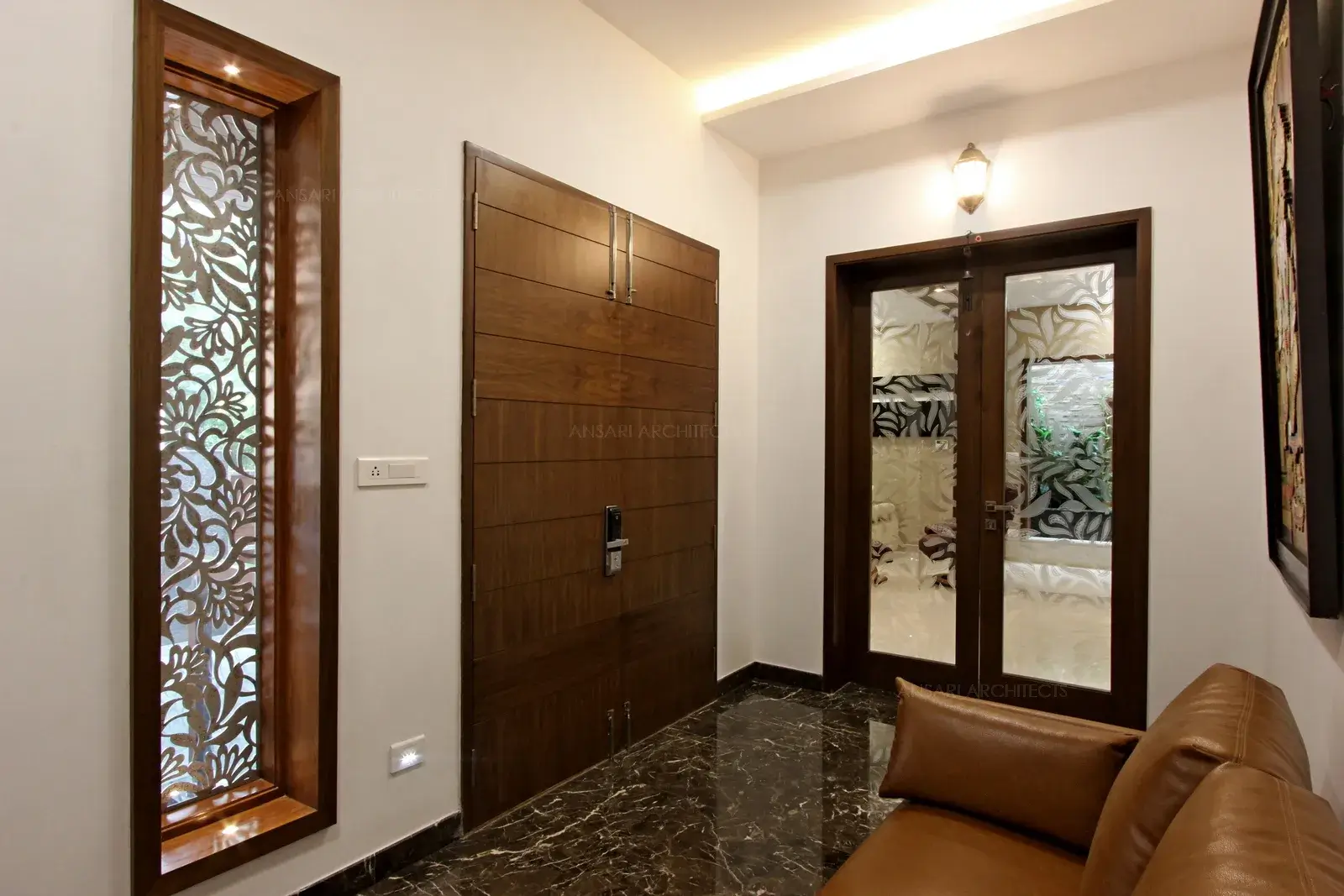 Floral patterns in the windows (which acts as a safety grill) with rich detailed glasses with vibrant setting for floor. False ceiling adds to the detail with lighting.