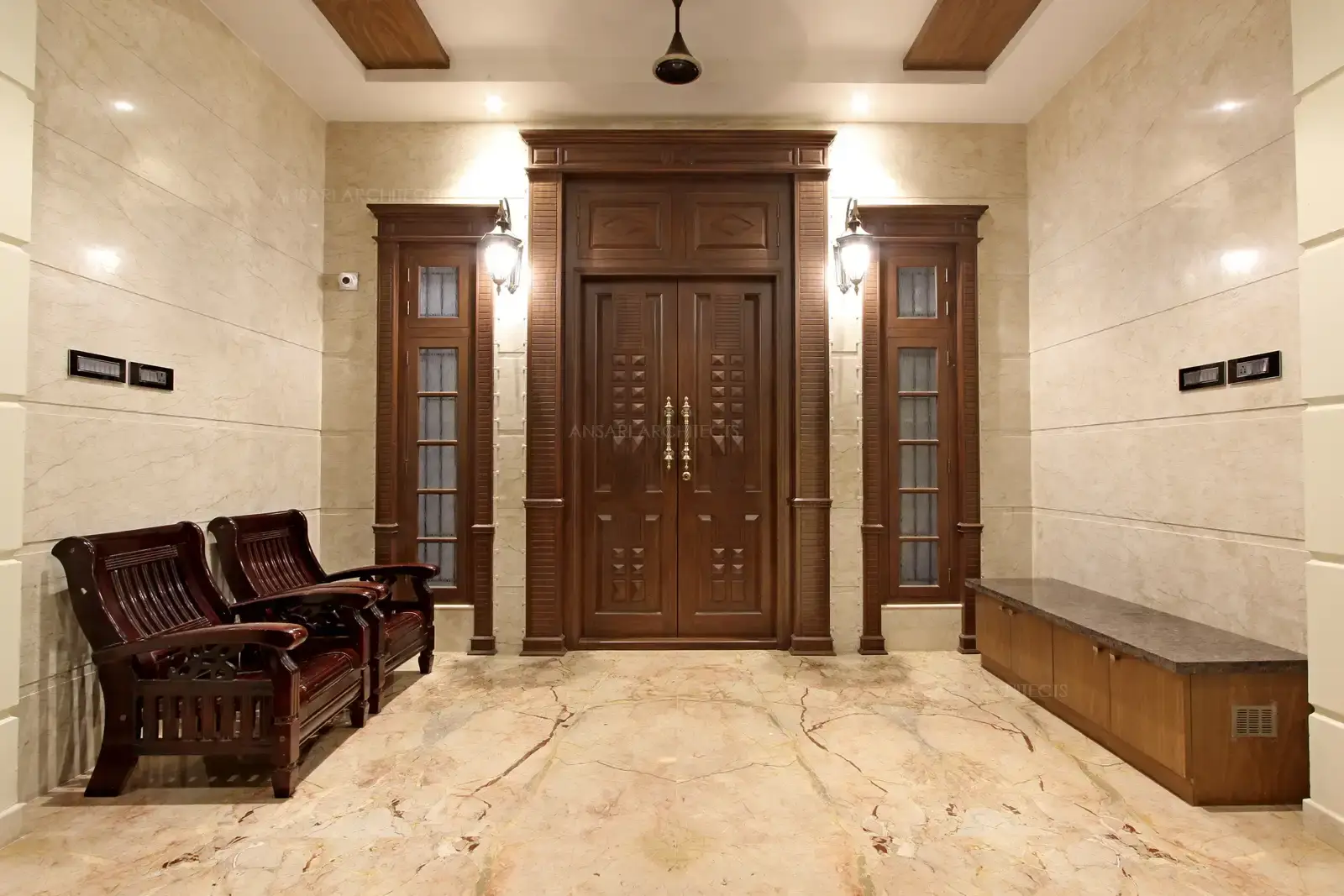The entrance lobby creates a royal look with wooden door creates a massive outlook.