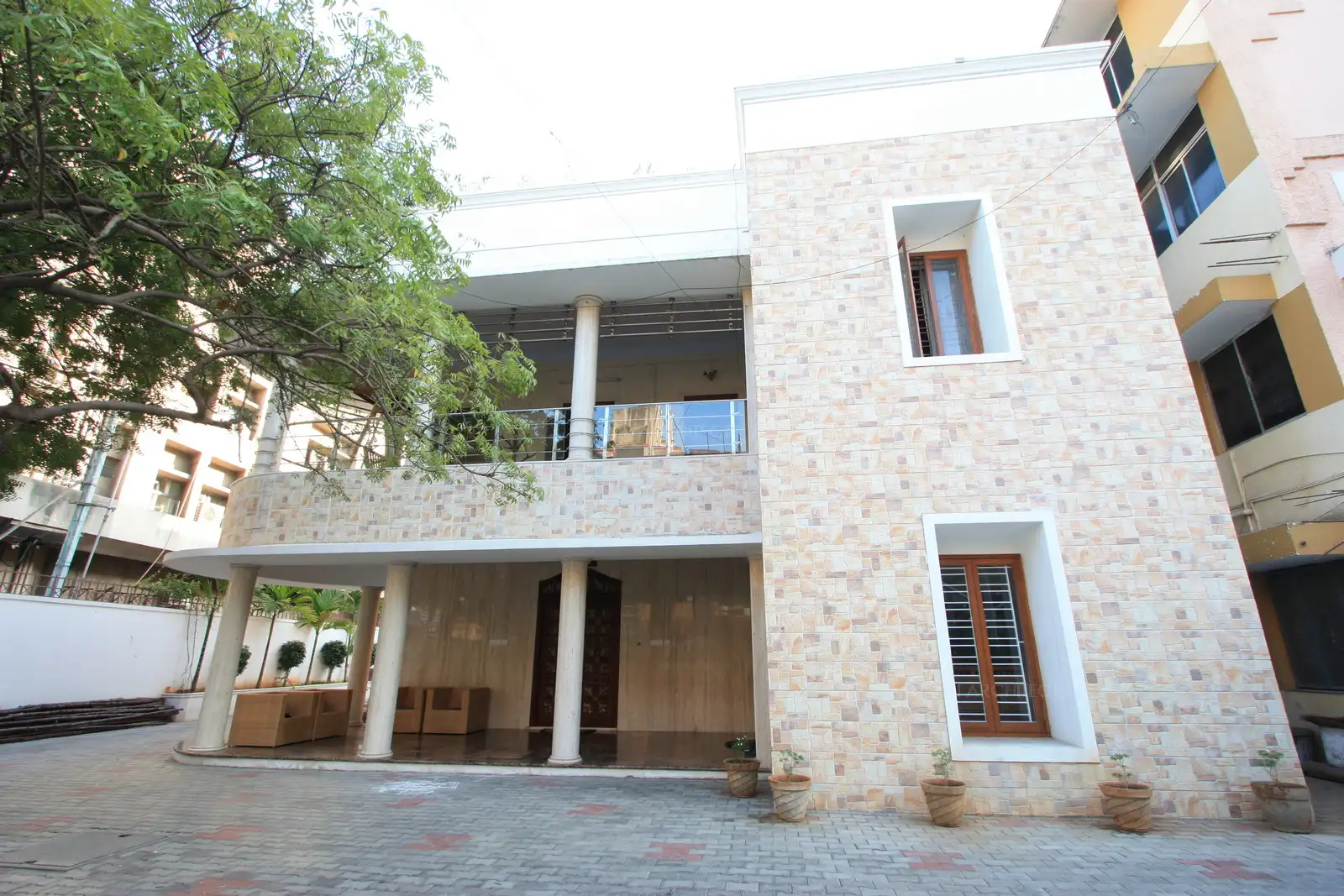 Exterior of the building, finished with new stone cladding, and some contemporary Stainless steel handrail elements