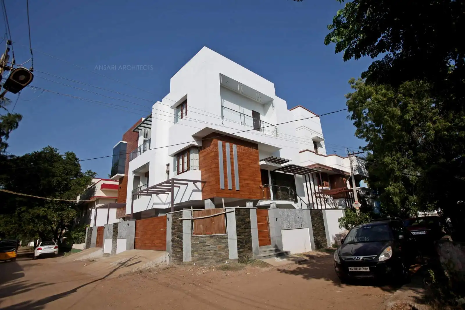 The exterior of the building is a combination white and wood cladding which looks very appealing . Woods create an accent feature by addingg more focal points.