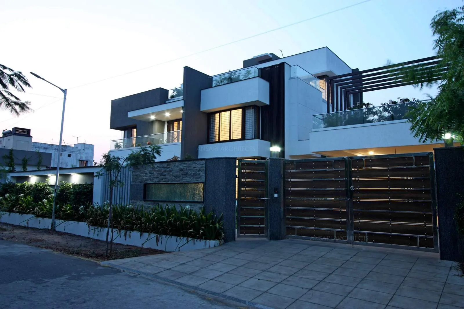 The exterior facade is combination of several architectural elements that bring a solid, bold outlook to the contemporary facade. The expansive green connects with the exterior of the building harmoniously softening the solid outlook.