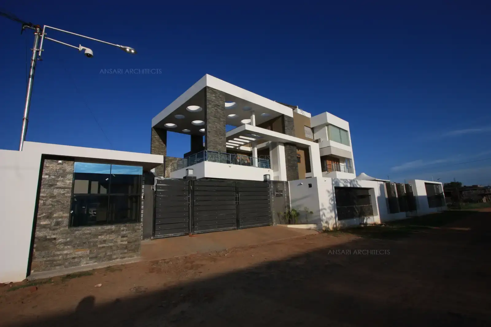 The west facing building has been designed in such a way that the amount of sunlight and heat is reduced by pergolas at diffrent levels.