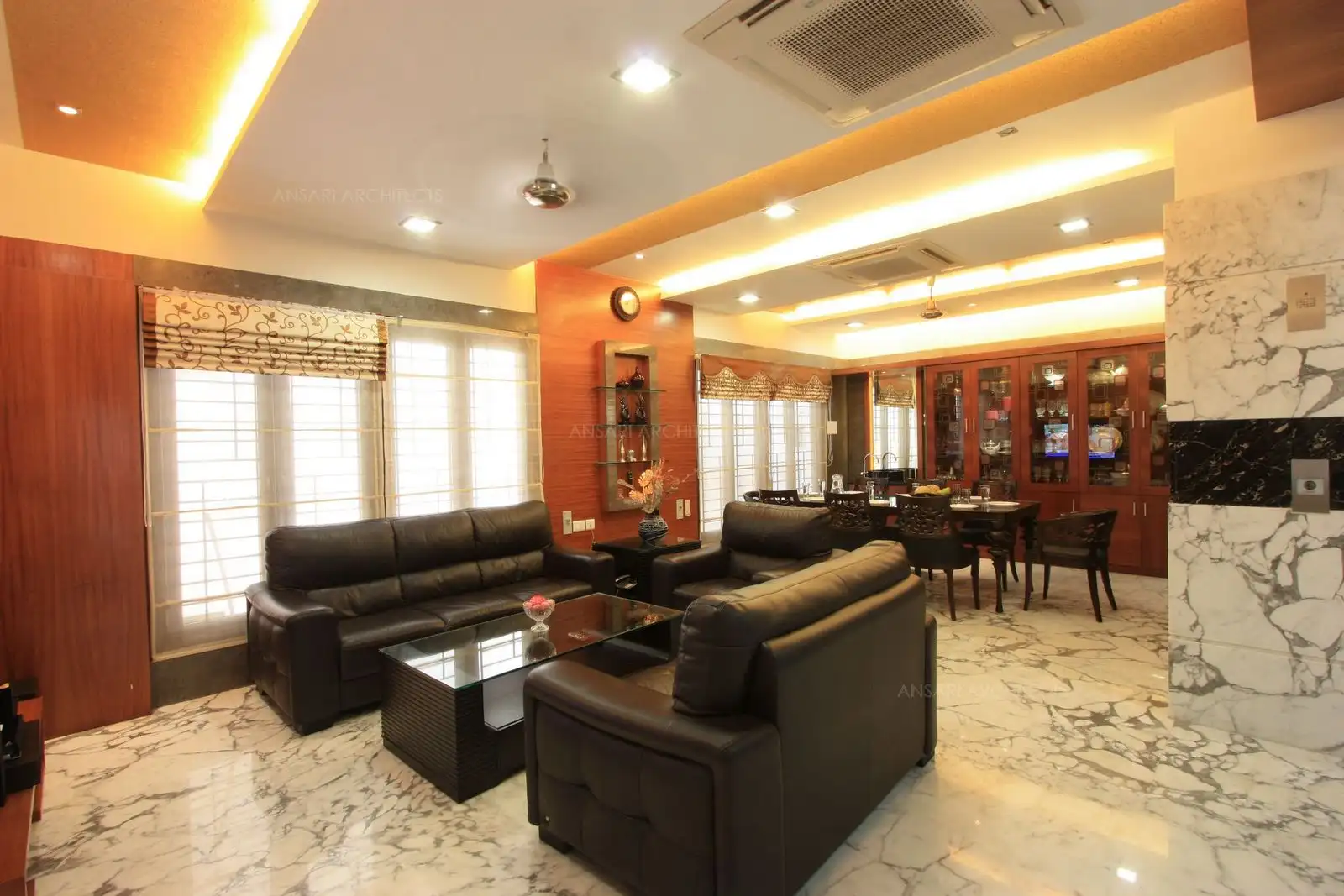 The living and dining room in the ground floor have large French windows, allowing abundant natural light.