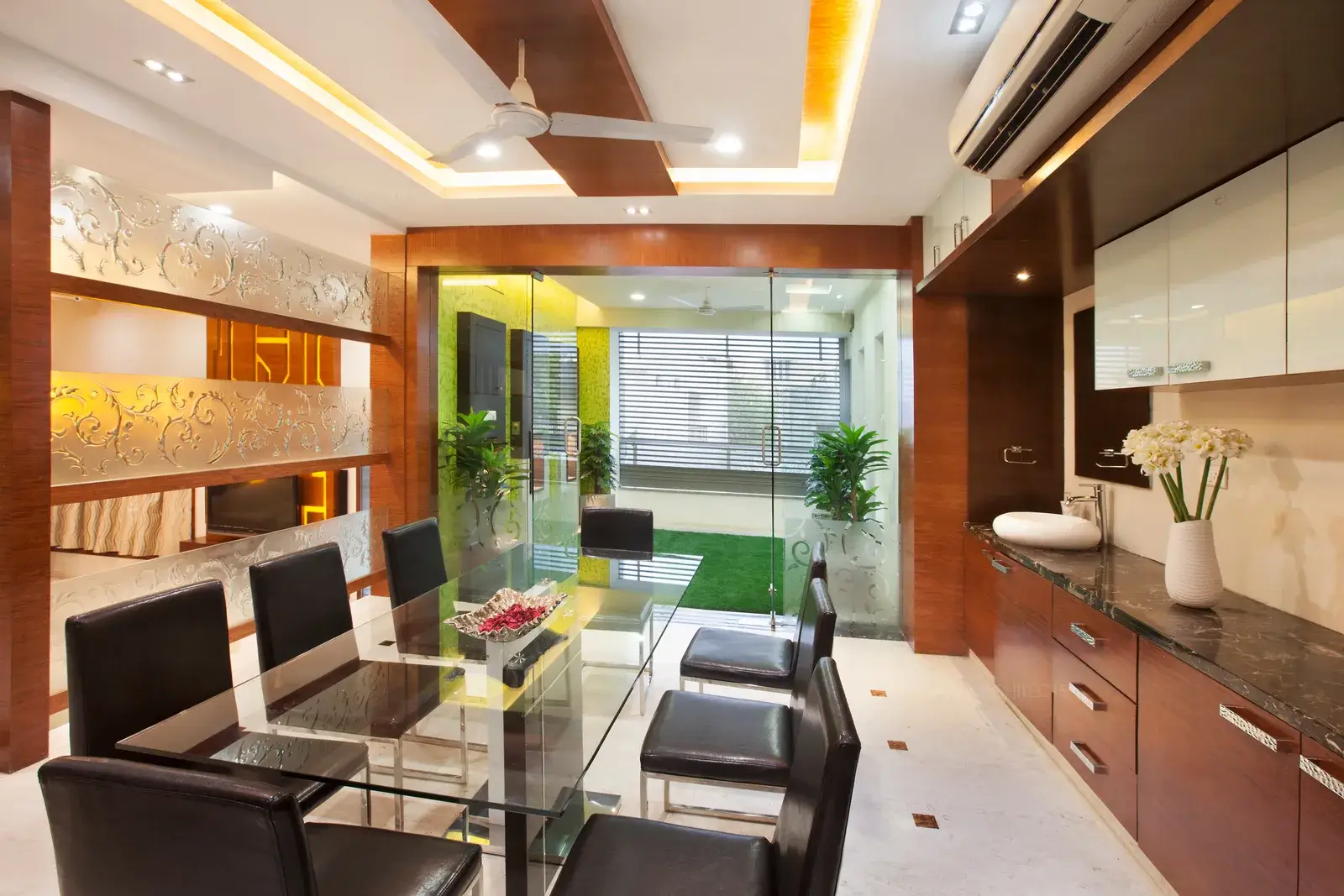 The Dining Room Facing the Sit out with artificial grass turf, giving it a feeling of sitting and dining in a Garden.