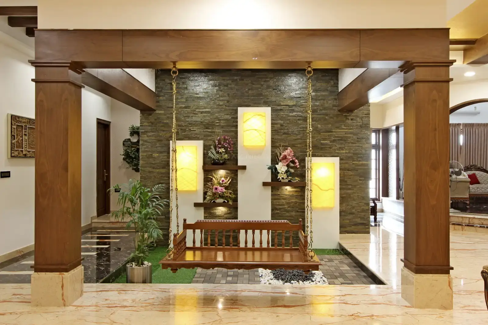 The columns are solid and bold with wooden finish and the swings acts as the focal point for the space