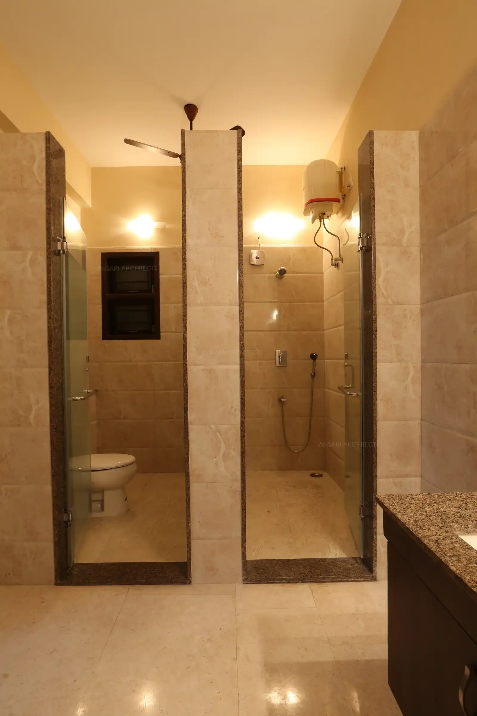 Water Closet and shower area are divided as per client's requirement.Staircase railing in wood and glass designed around central courtyard.