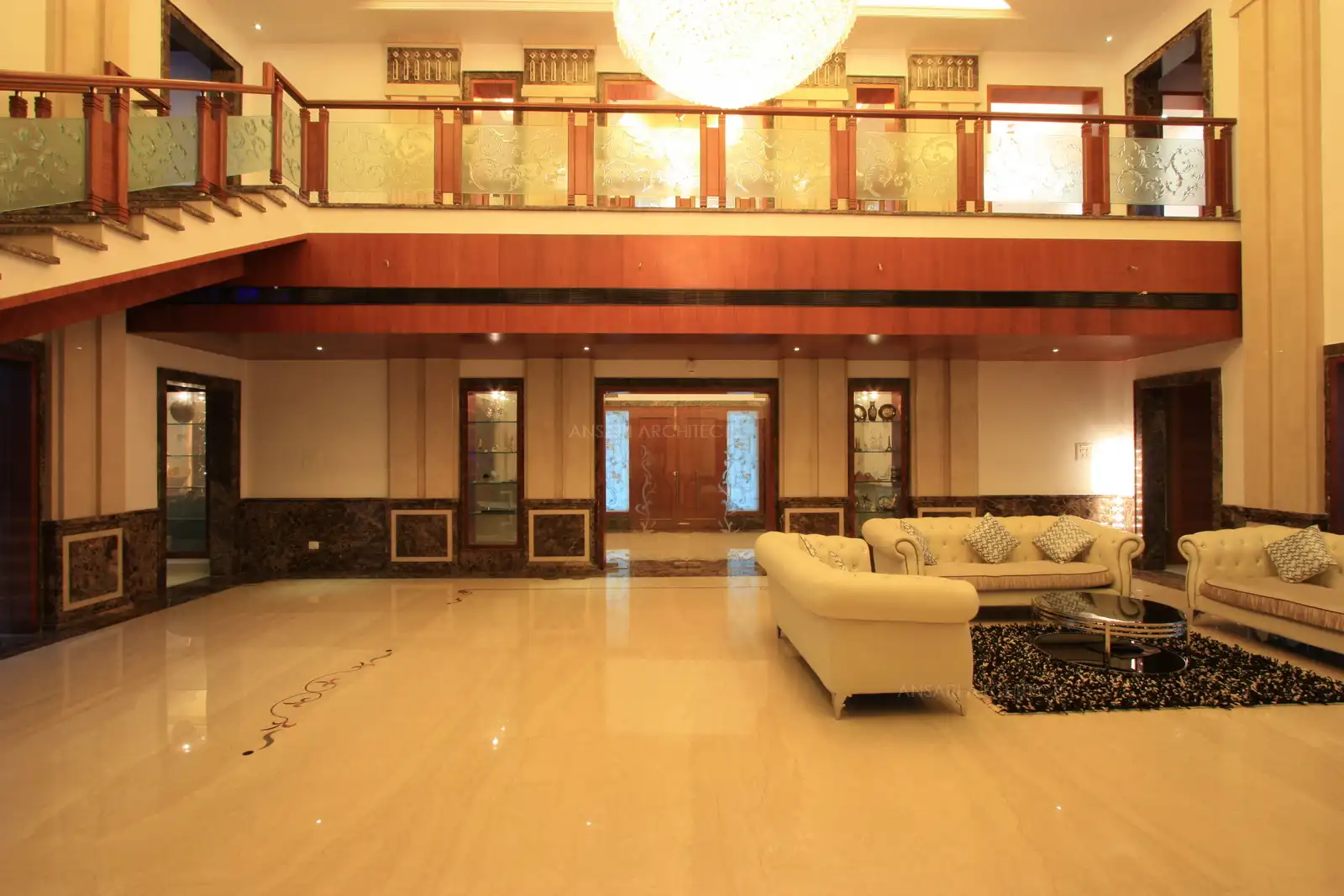 Traventino marble along with Dark Emperador used for flooring and wall cladding give a classy look to this royal house.