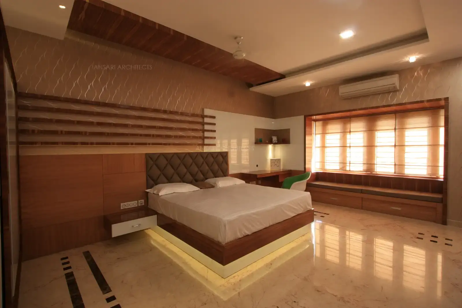 Master bedroom in the ground floor has been designed with neutral colour scheme.