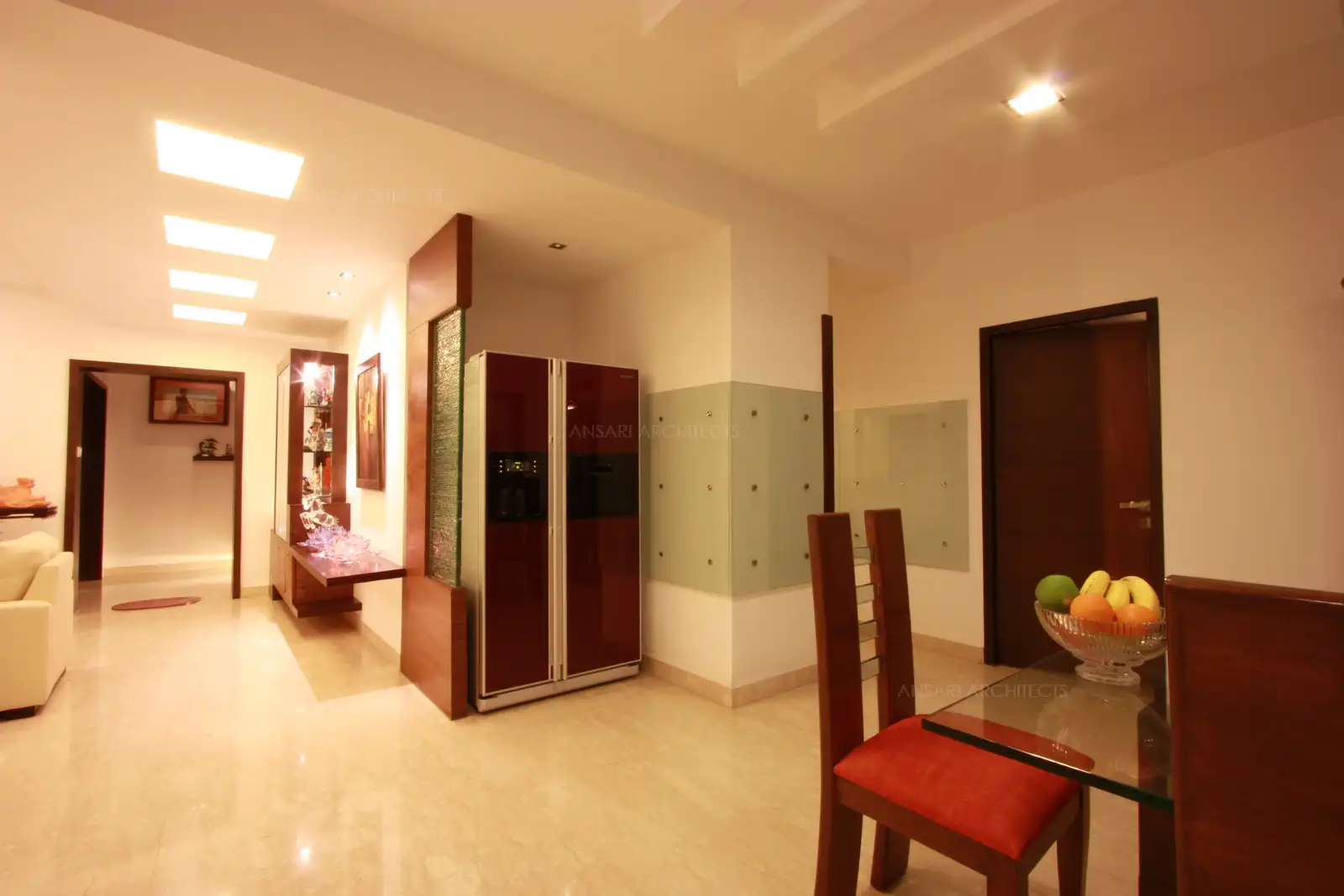 Glass panelling has been provided around kitchen and fridge area for easy maintenance.