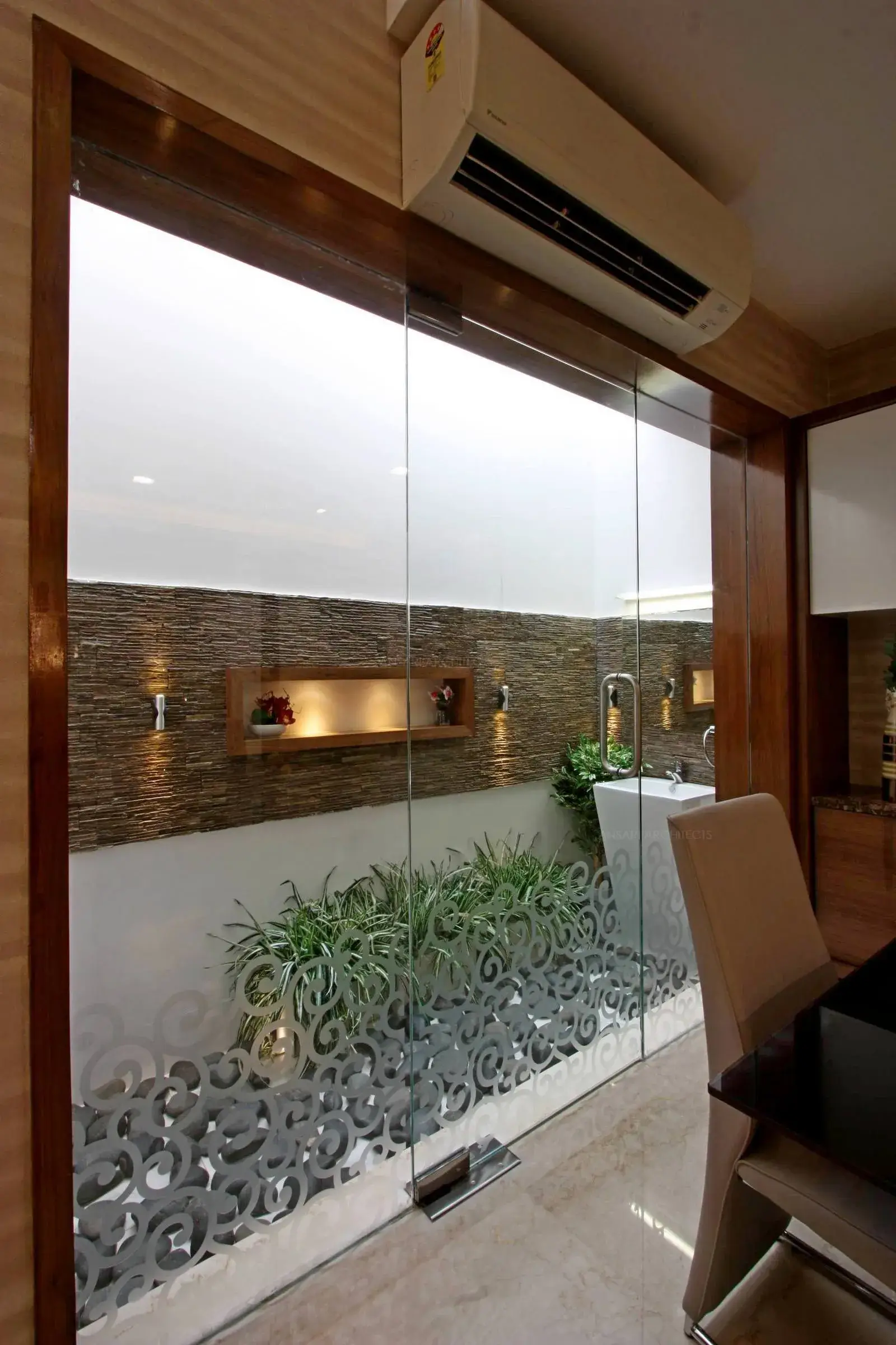 Courtyard is provided with natural light to brighten the entire space highlighting textures and hardscaping. 