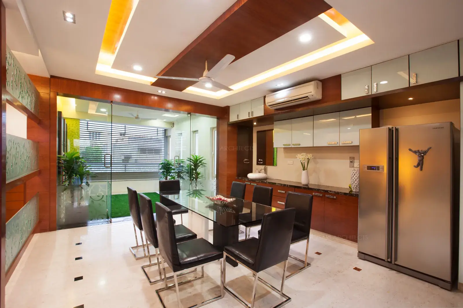Dining room facing the lush green sit out area.