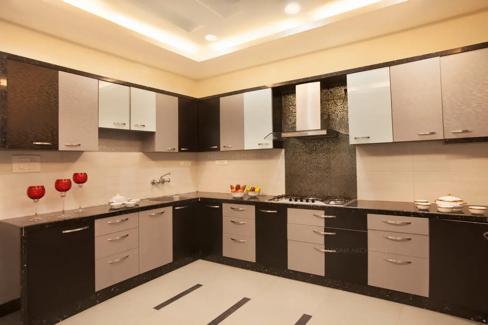 Sleek and simple kitchen on South with ample amount of lighting.