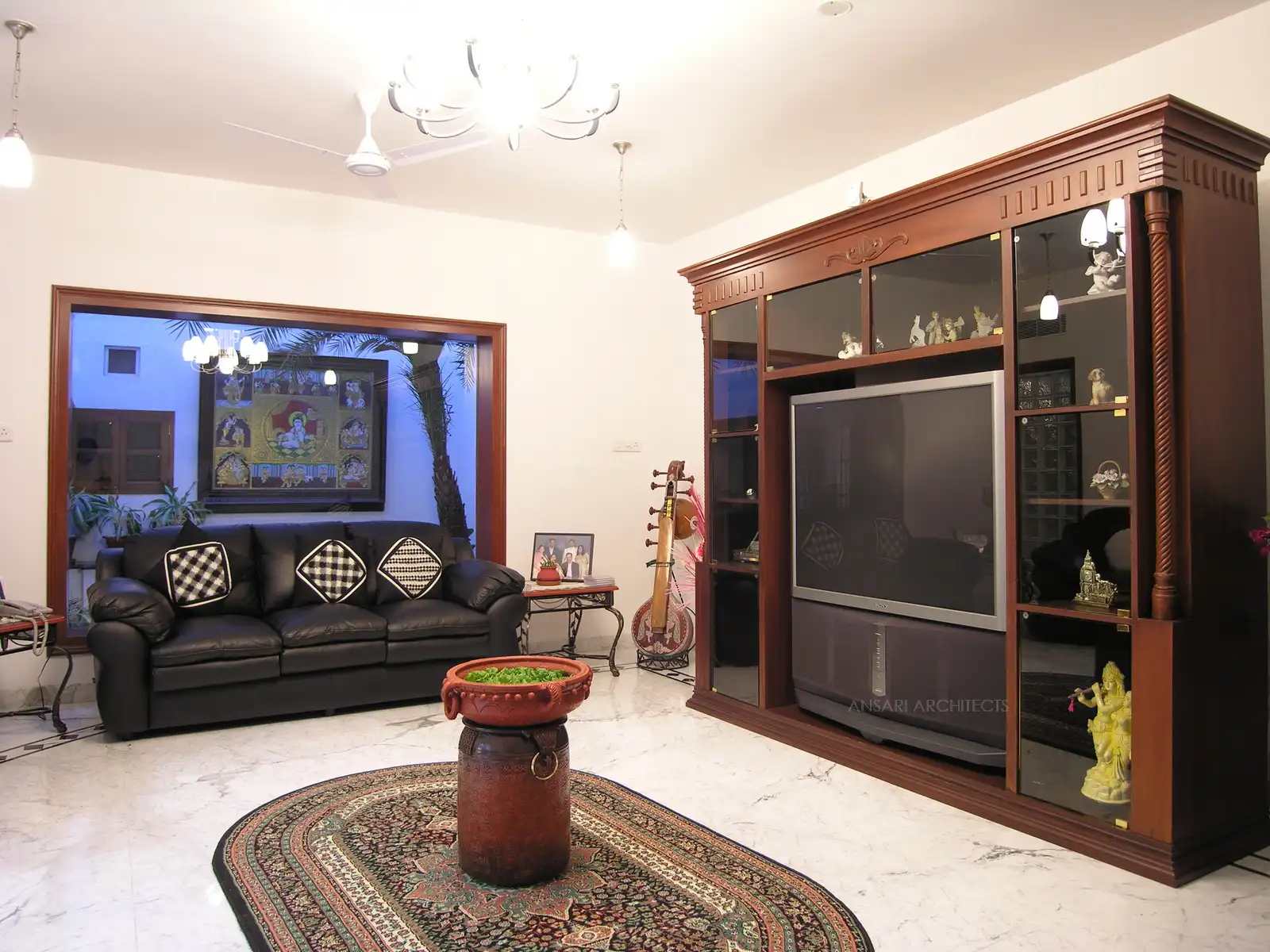 The living room gets a direct view of the courtyard.