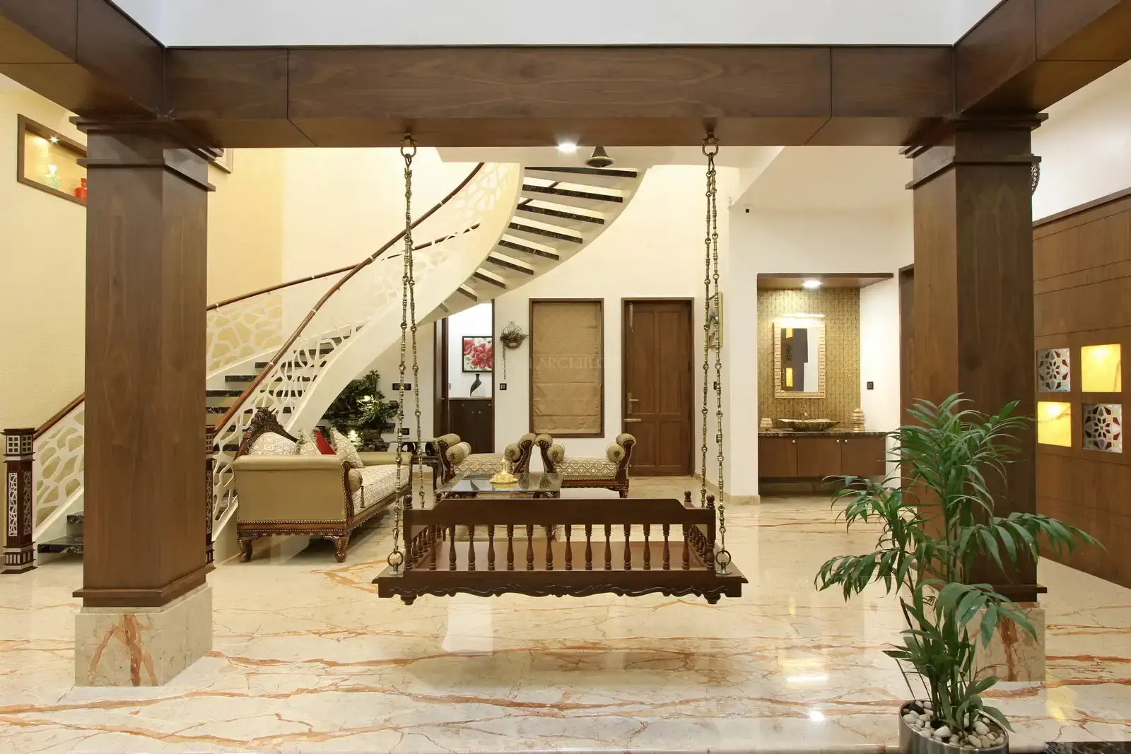 Plush furnishings add sense of luxury and which infuses a pride of colours into this light space.