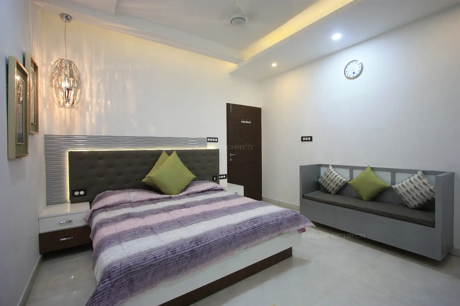 Use of different texture in the finishes give this guest bedroom a modern look.