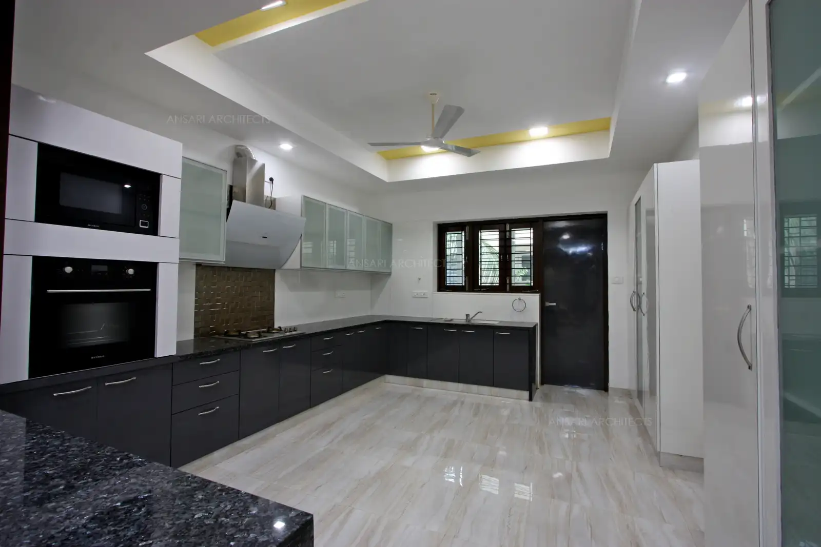 The Modular kitchen has been designed with neutral colour scheme creating a contrast at the south east corner of the house.