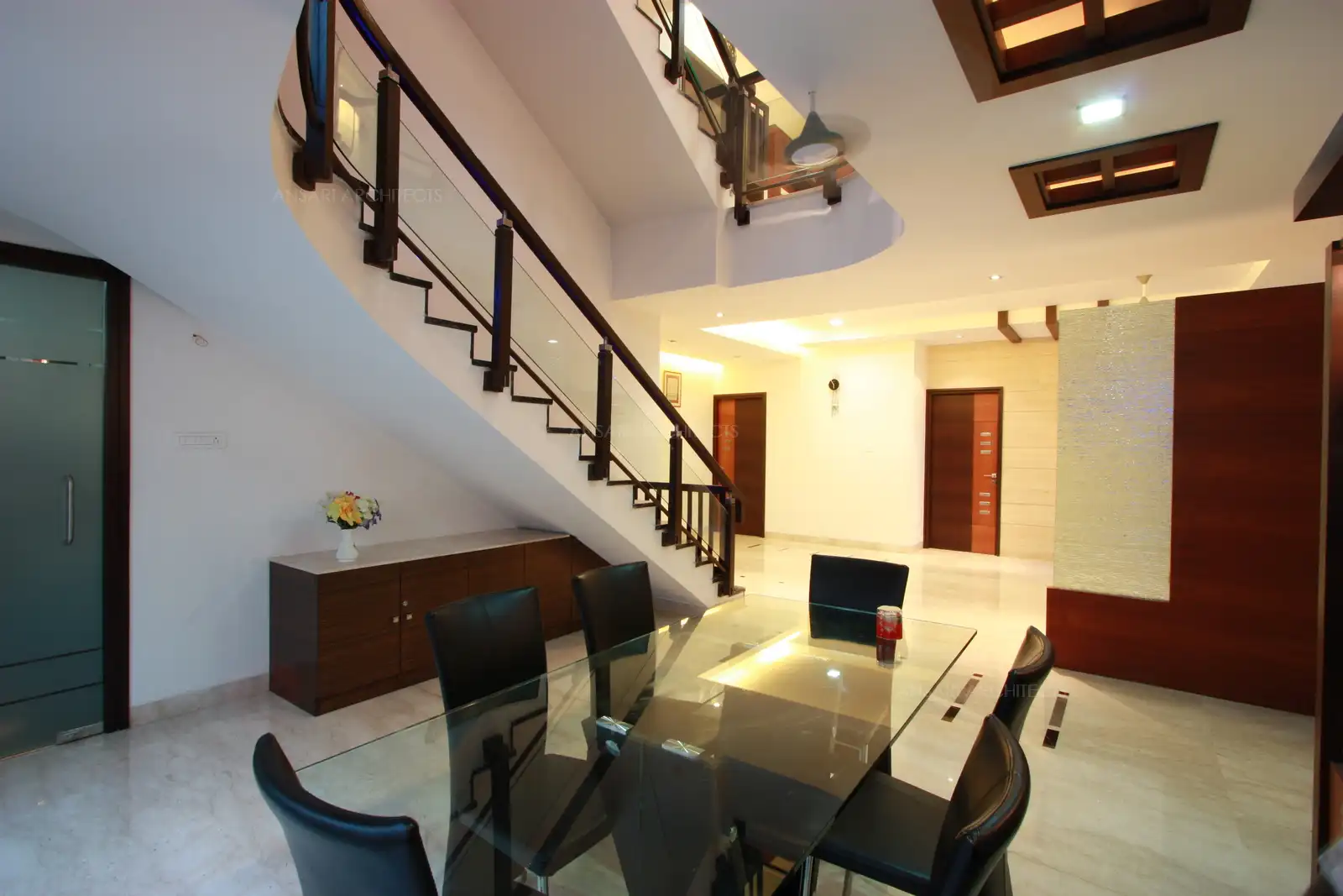 View of dining area showing courtyard,crockery unit and the staircase which forms a perfect corner for a formal dining area.