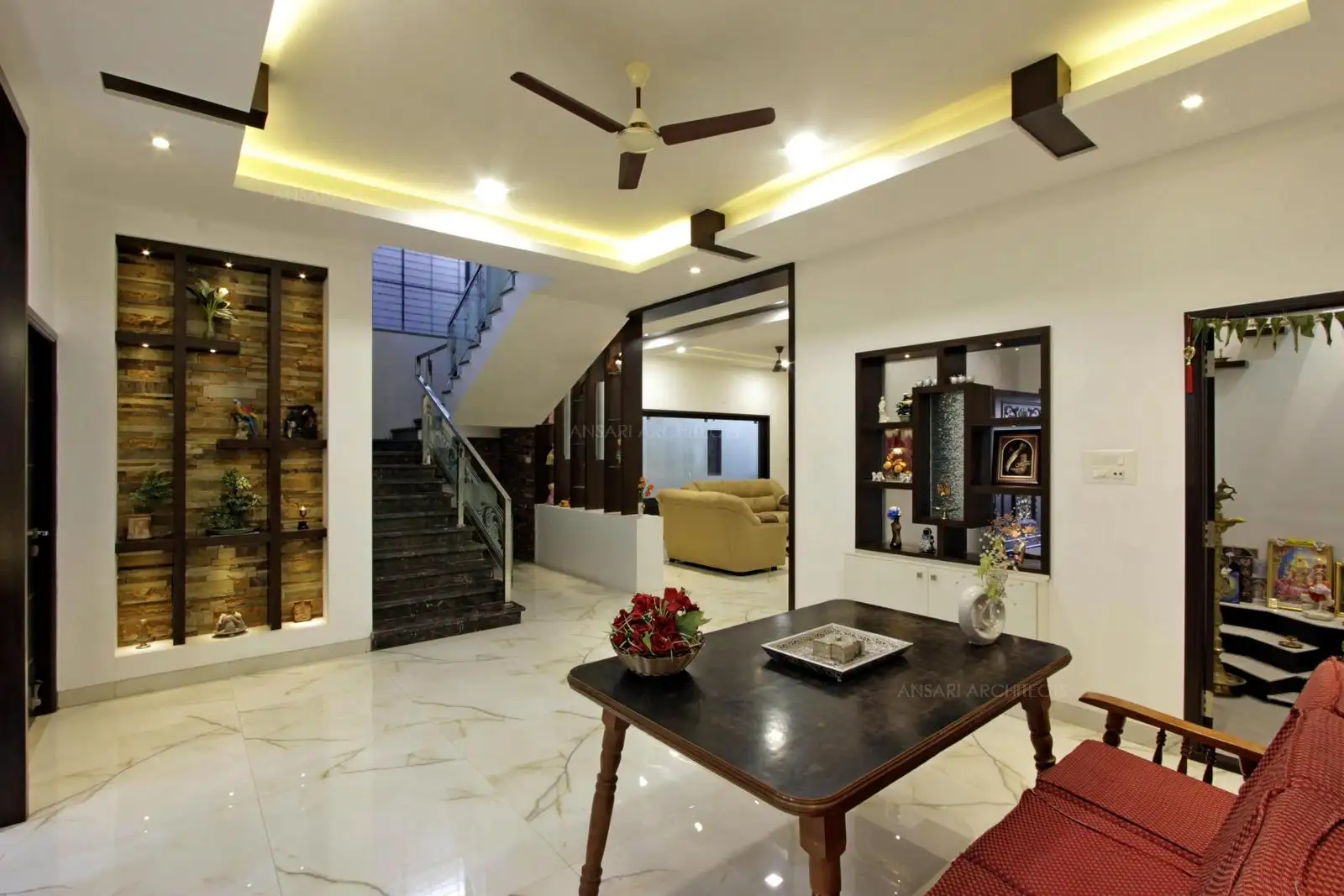 The lobby connects different spaces hall, kitchen and puja looks connected with the space.