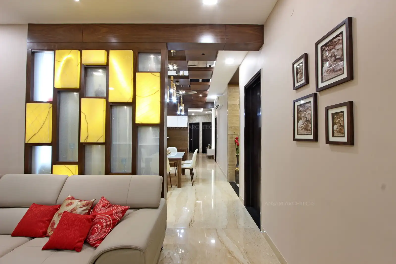 The partition wall creates a charming and subtle mixed scheme, dark wood dominates the combination, ceiling has a set of soft lights that provide subtle glow.
