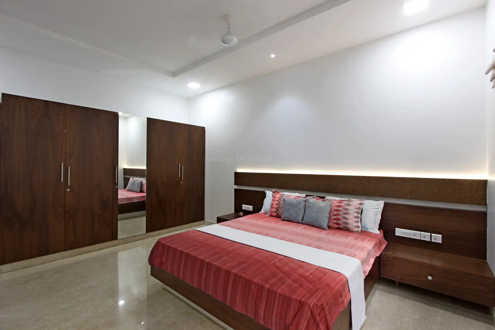 Balanced lighting highlights the design features of headboards with a yellow illumination to set a warm and luxurious look. Wardrobe offers a classic look.