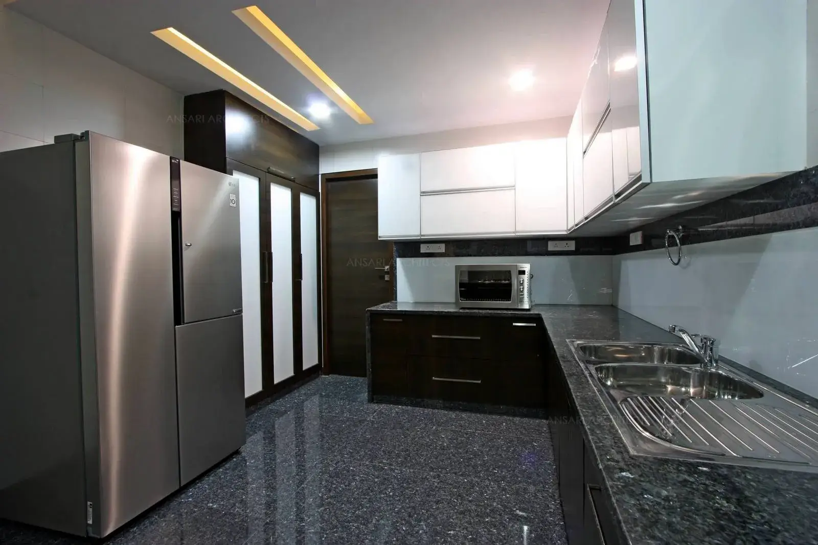 Modular Kitchen with cove lightings for better lighting.
