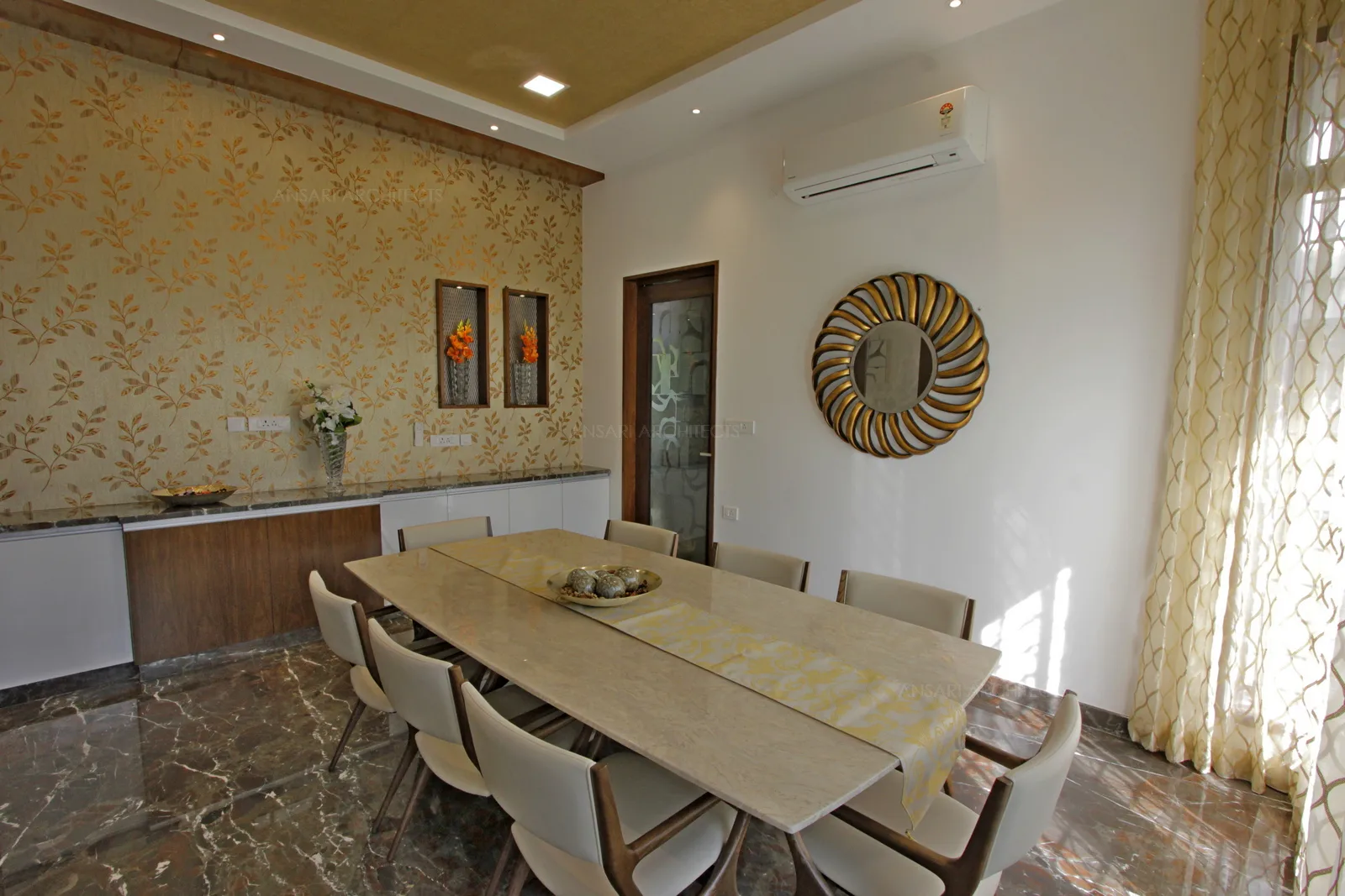The neutral palette is classic and elegant. This dining space personifies all the qualities- leather upholstered chairs, dark-toned flooring add to sophiscation of the space.
