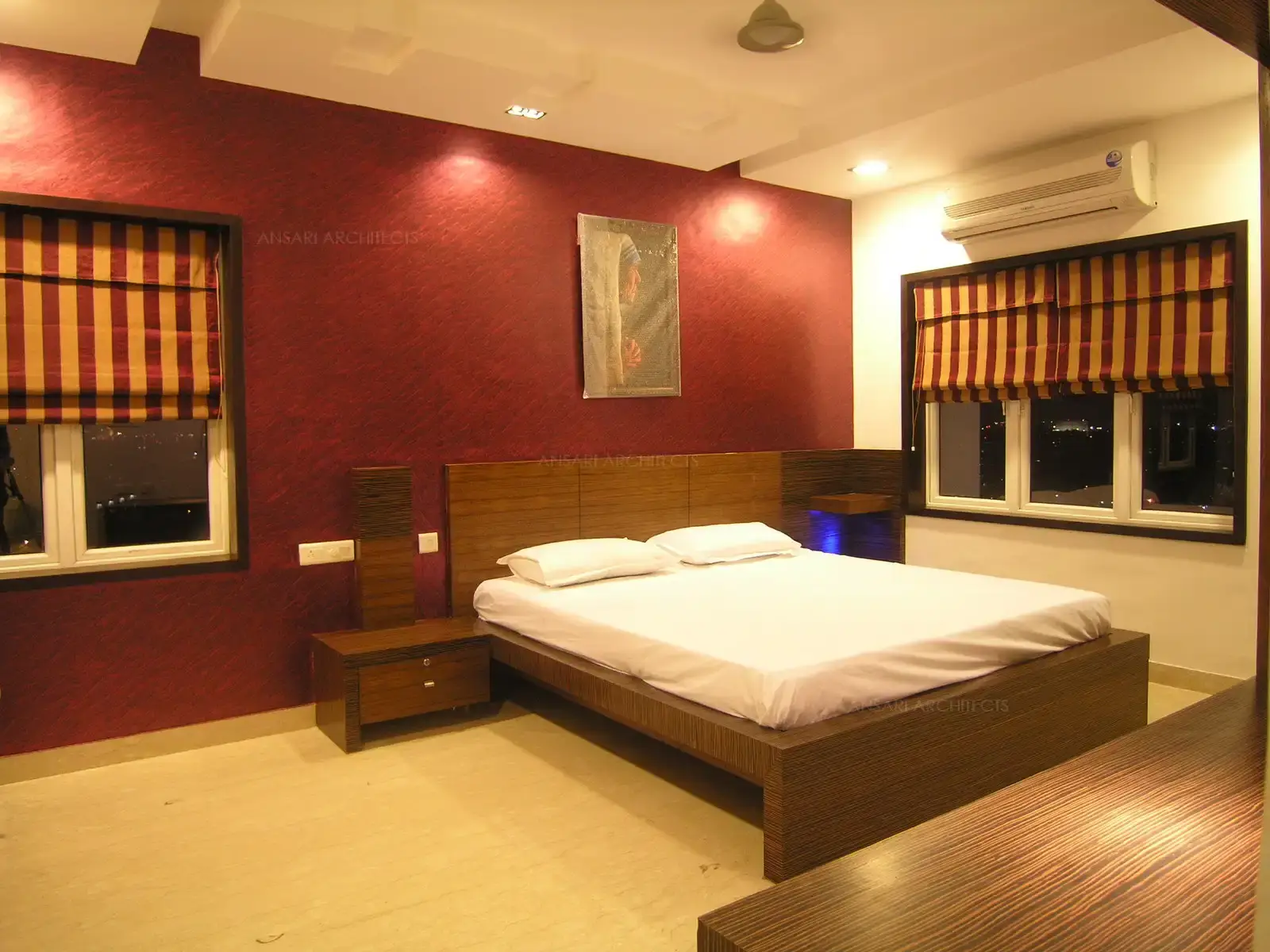 Bedroom-1 has contrast colour feature wall behind the bed which is finished with a single shade of veneer.