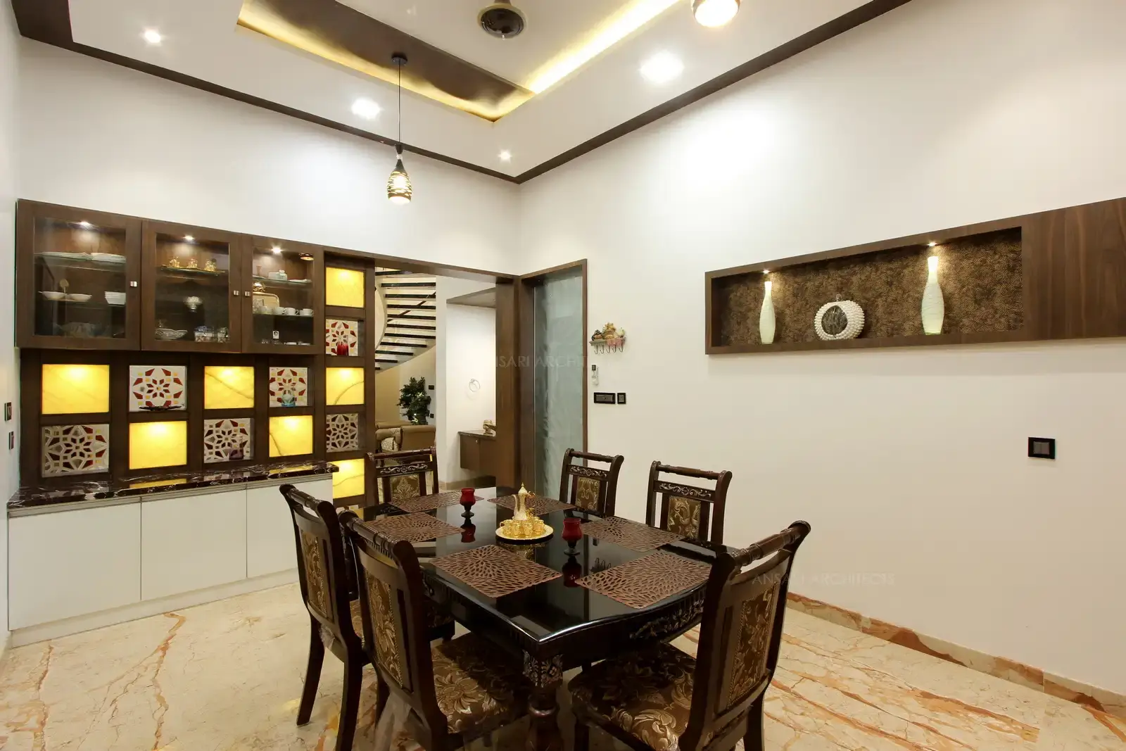 Dining area has a sense of subtle luxury and functional use of furnitures and storage with warmed wooden aesthetics