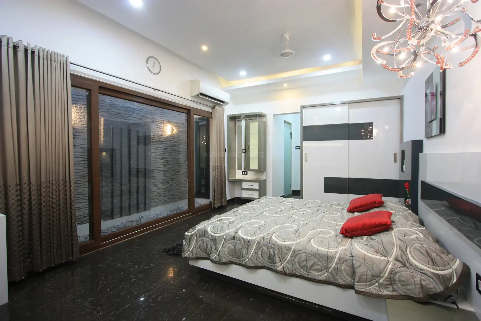 The master bedroom has been designed with smooth and glossy simple furnishers.