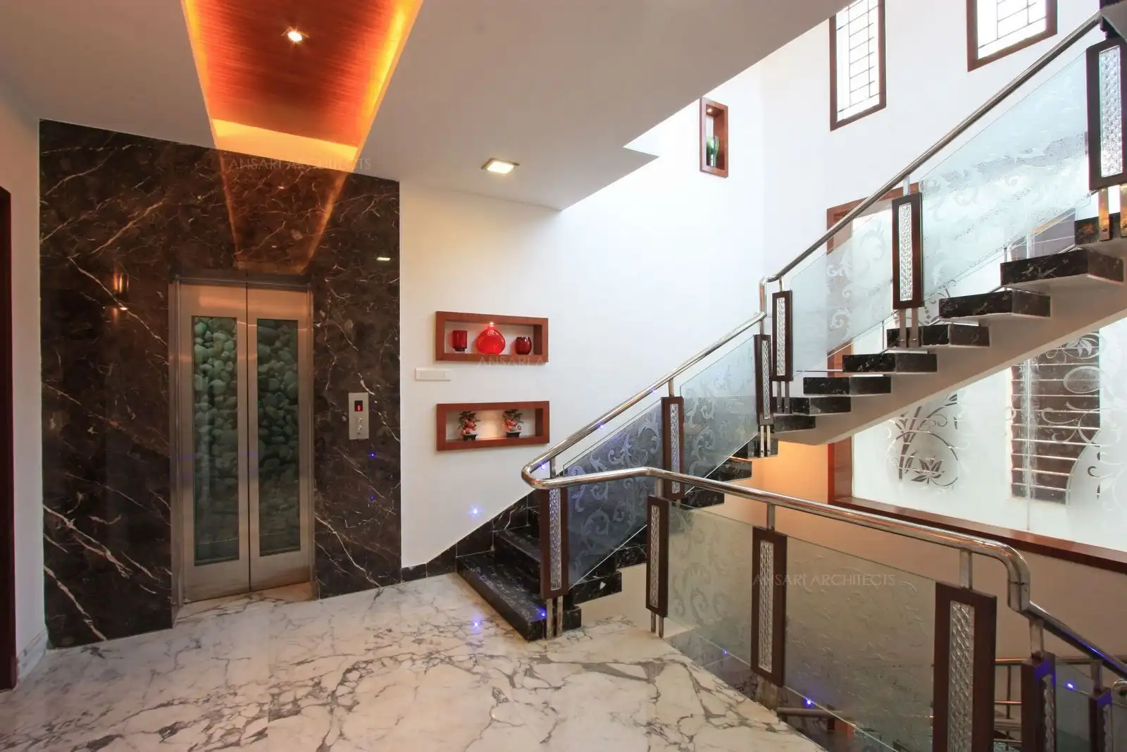 Handrails are designed with multi material: frosted glass, Stailess stell and wood