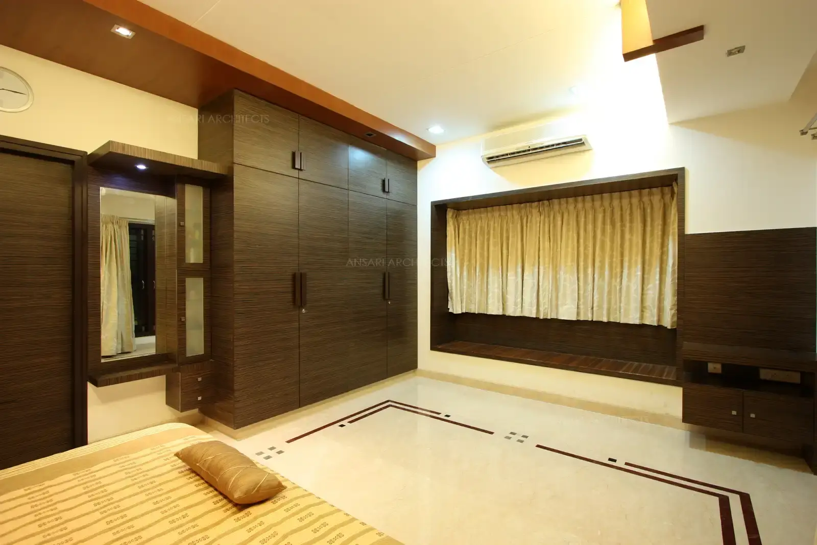 Wooden panelling around the window makes a nice seating area in bedroom-1.