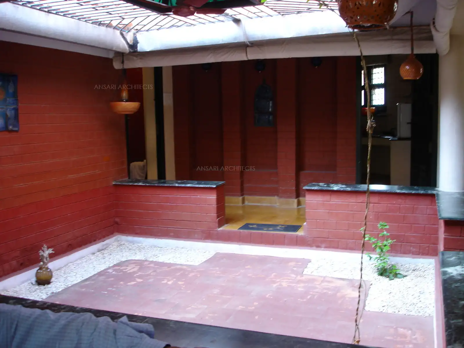 Courtyard designed with red terracotta bricks.