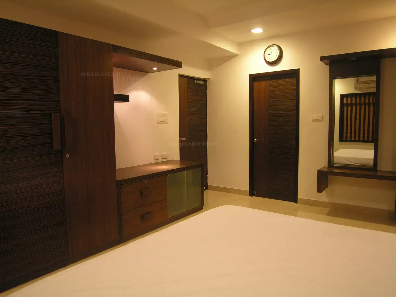 All the doors have been designed in two shades of veneer matching with the interiors of the house.17