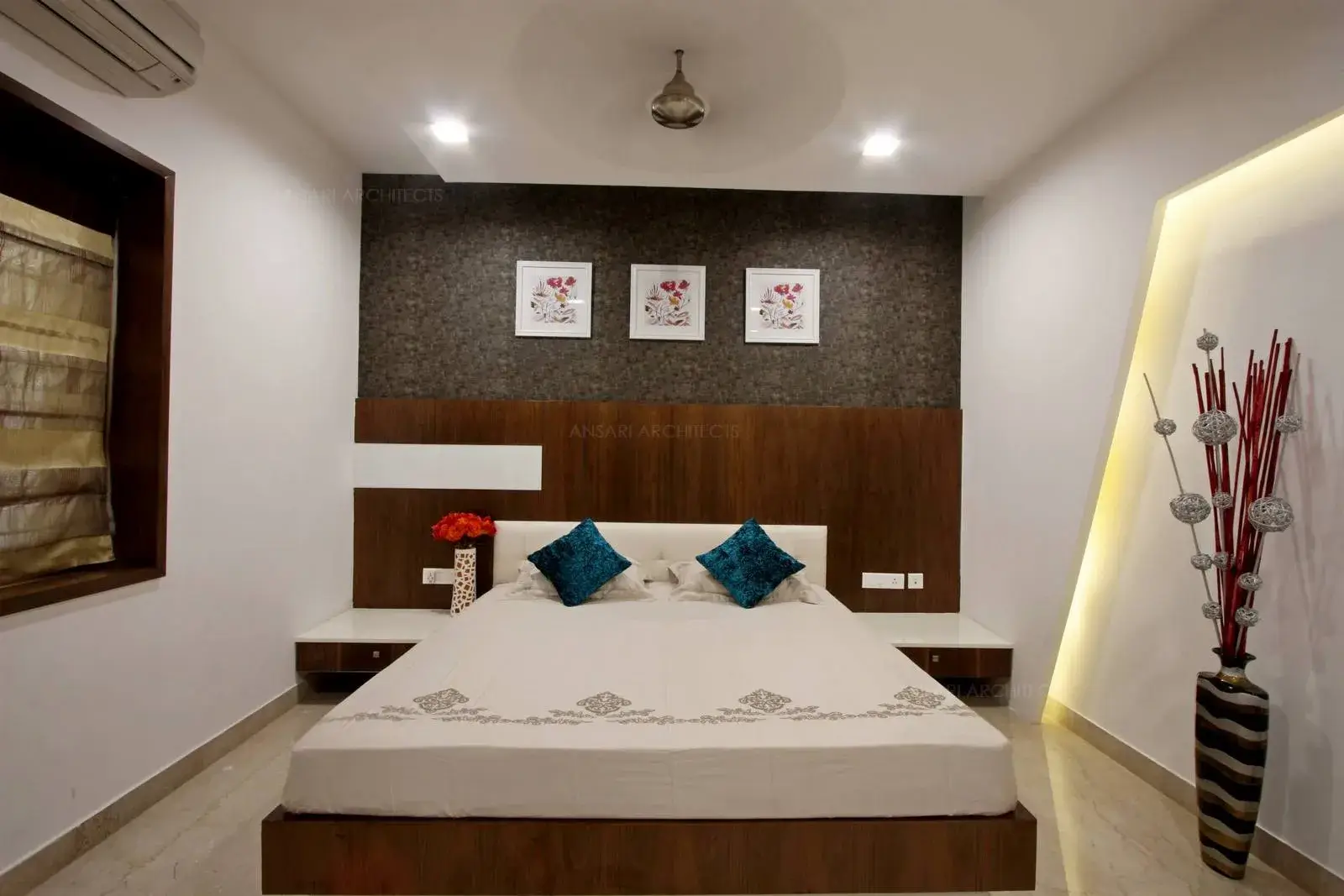 The bedroom space is highlighted with selected use of wallpapers with light colours which creates a sense of serenity to the space with sleek and slender furnishings which are eclectic for the space. The furnishings remain subtle for the bedroom area.