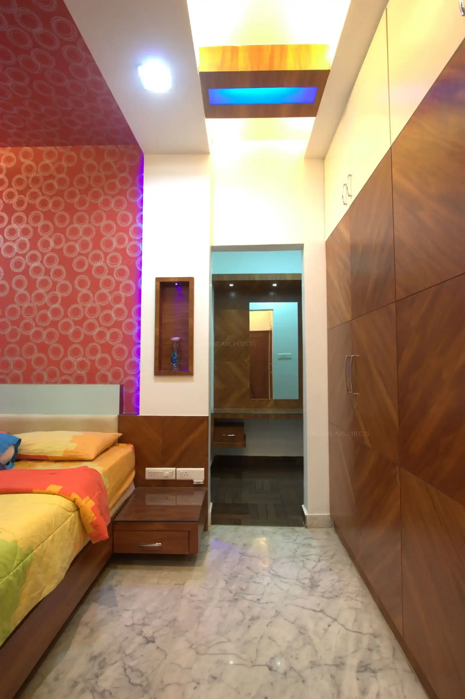 Dressing area in the bedroom-2 is demorcated in wooden flooring and follows the same veneer pattern as the room.