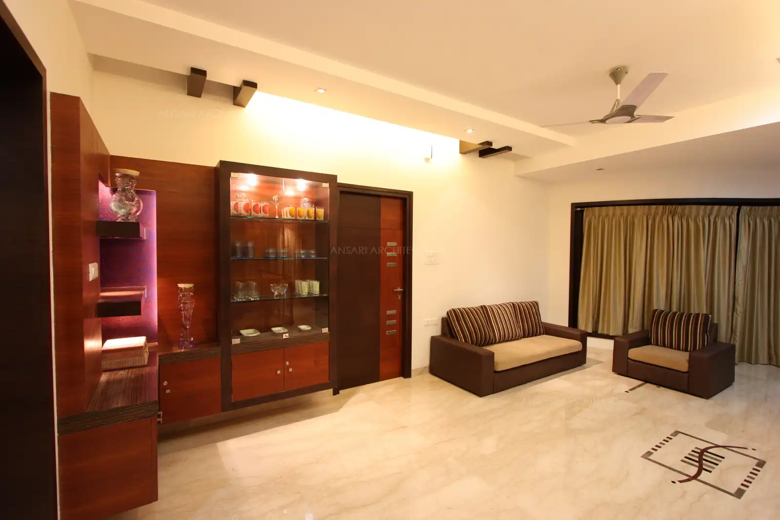 The family room in the first floor has simple furnitures for free movement in this common area.