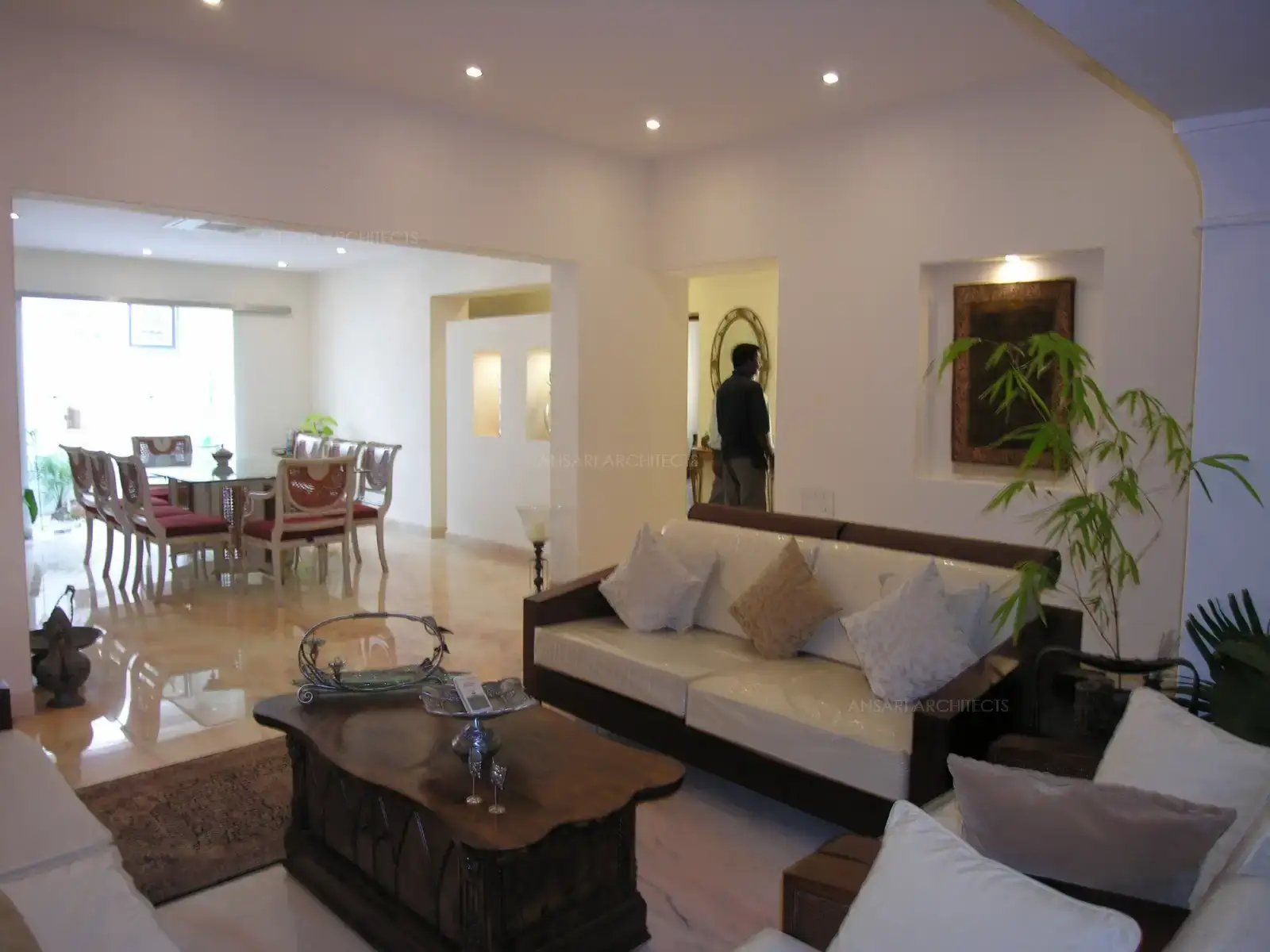 Plain white walls and simple false ceiling give a bright and spacious feel.