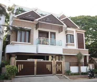 a house with a gate and trees